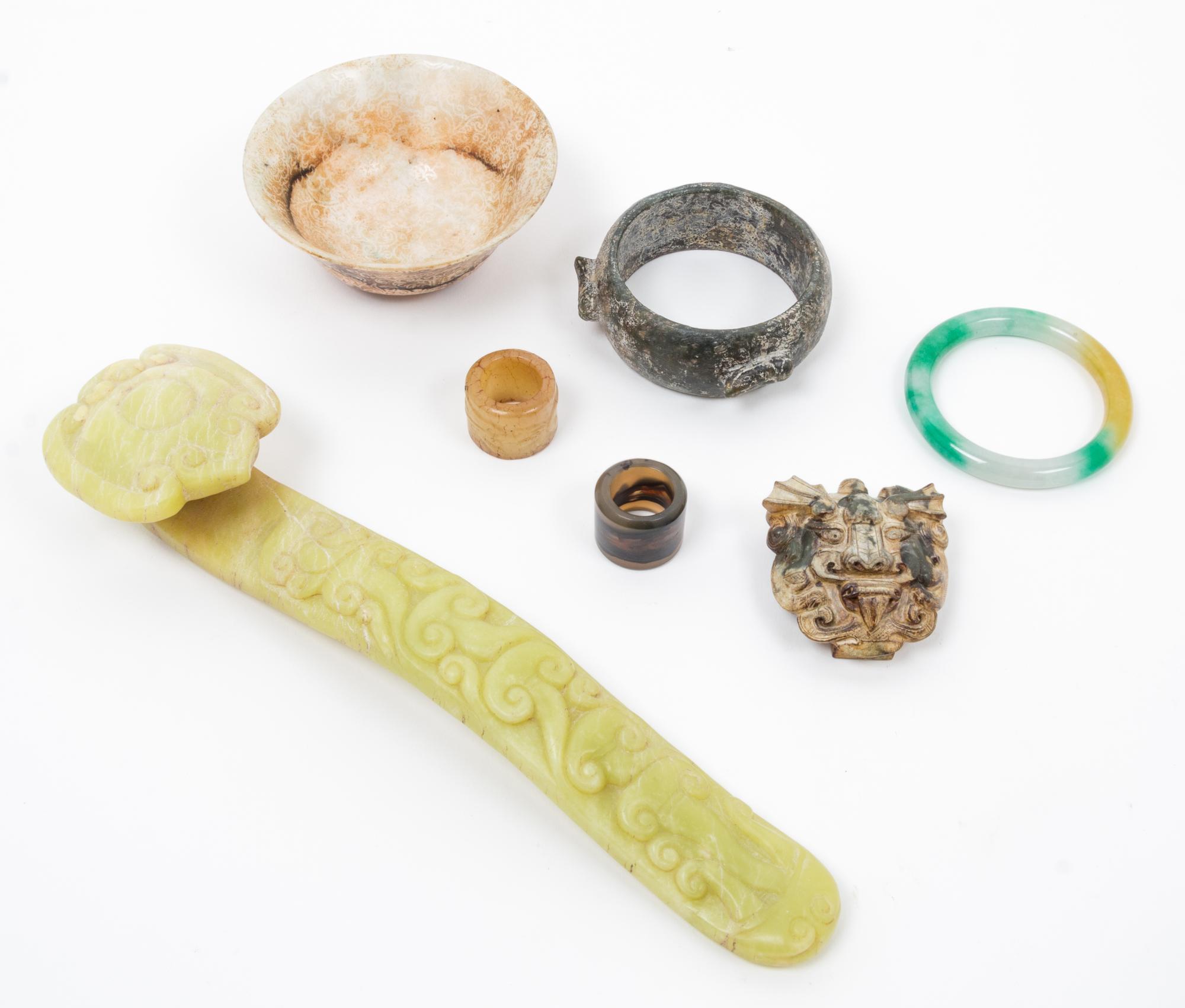 A Group of Seven Archaic Jade Items Length of largest 12 inches.