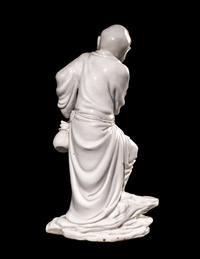 A Chinese Blanc-de-Chine Porcelain Figure of a Fisherman