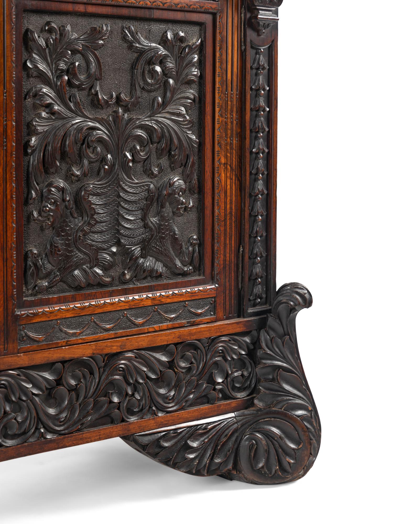 An Italian Rosewood and Carved Walnut Bookcase