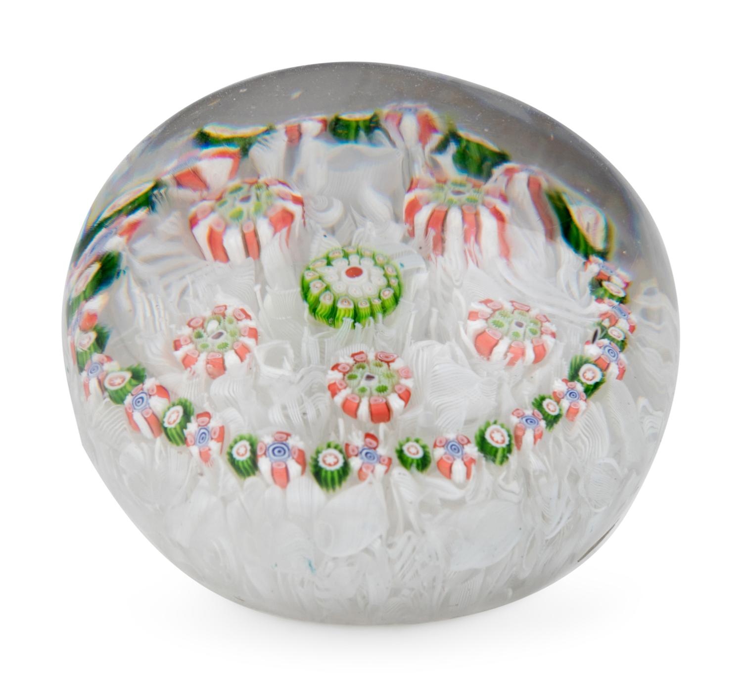 A Spaced Concentric Millefiori Over Upset Muslin Glass Paperweight