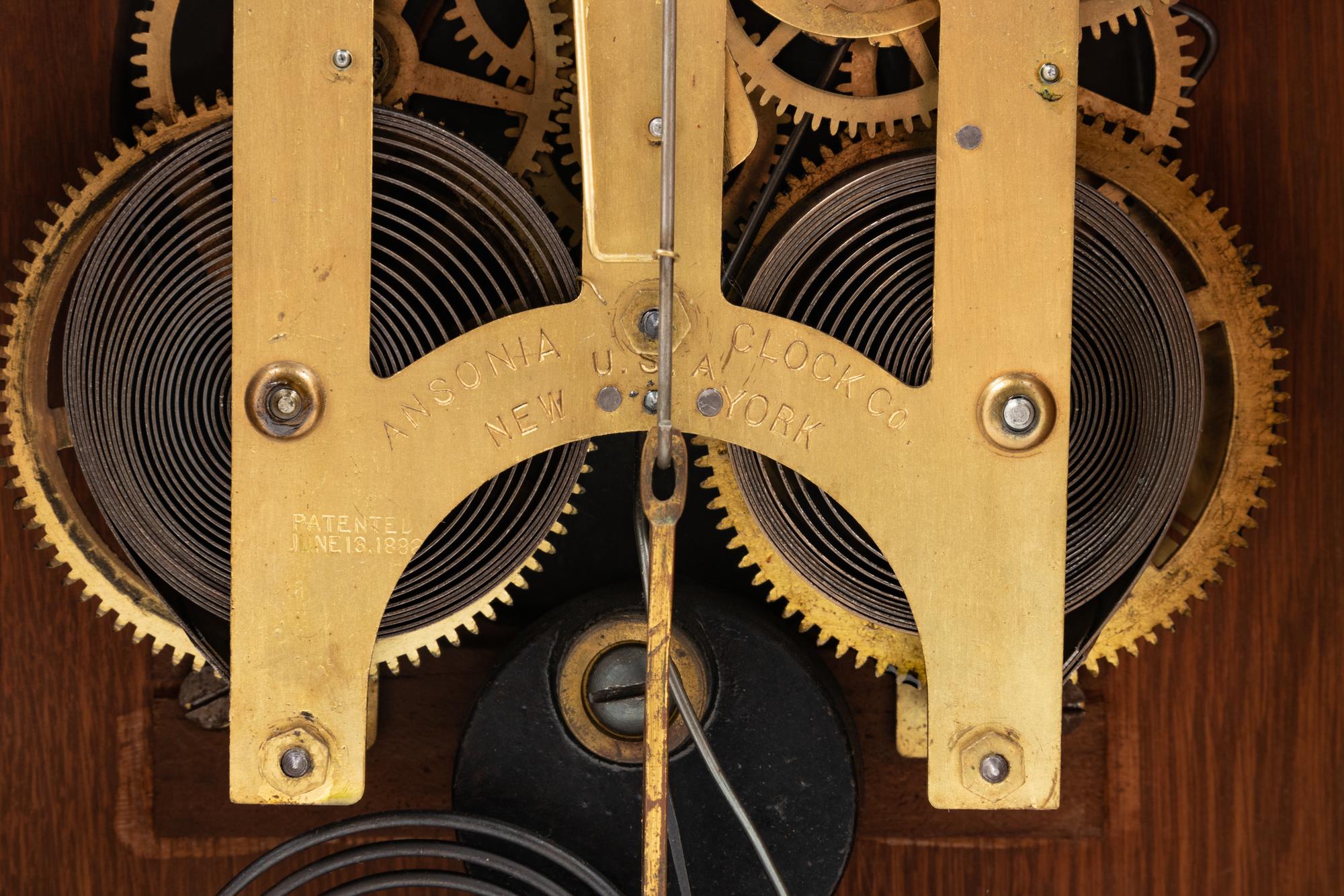 An Ansonia Cabinet A Brass Mounted Oak Shelf Clock