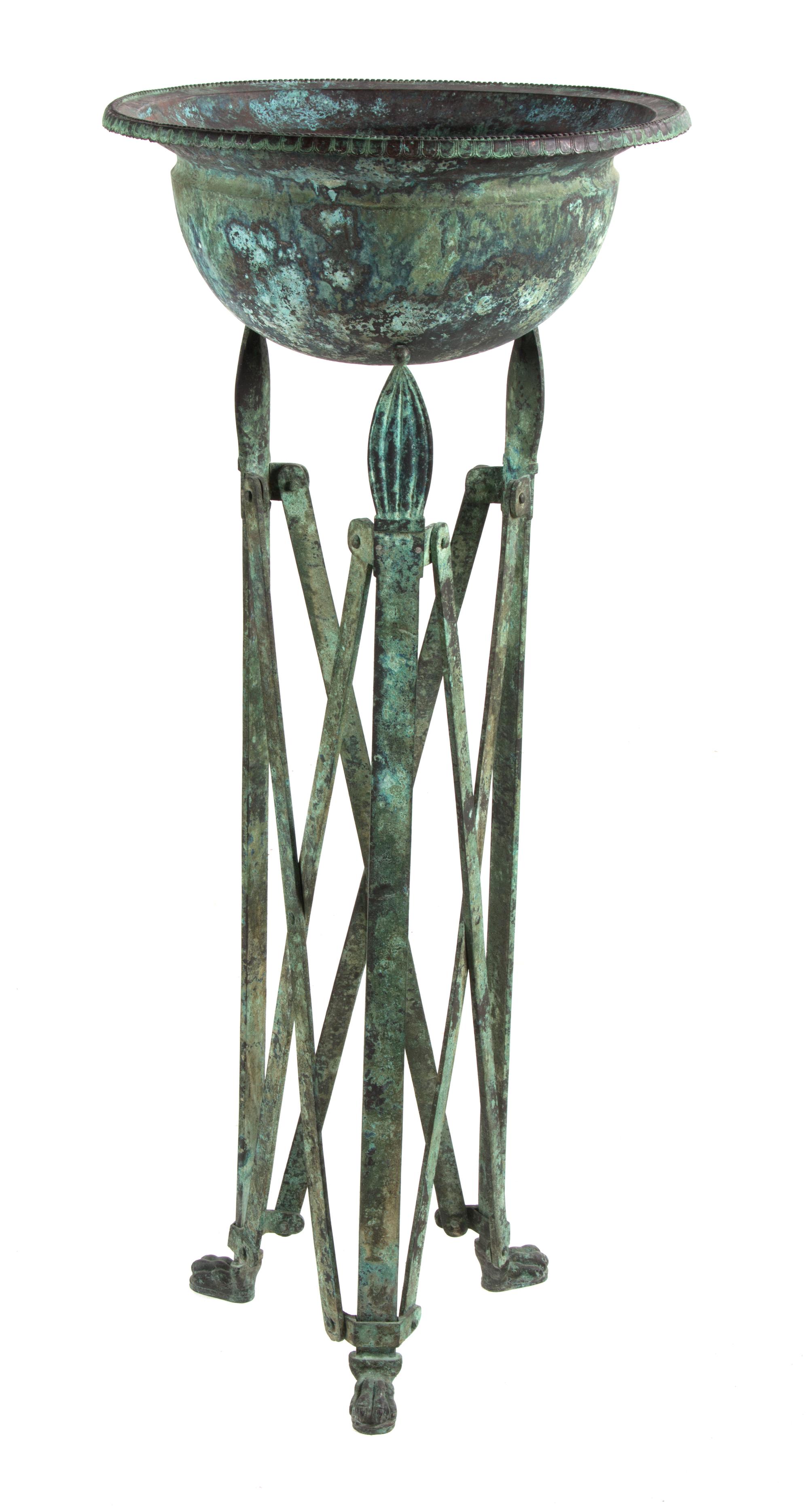 An Etruscan Style Patinated Metal Jardinière Height 41 1/2 inches.