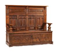 A Continental Carved Oak Settle