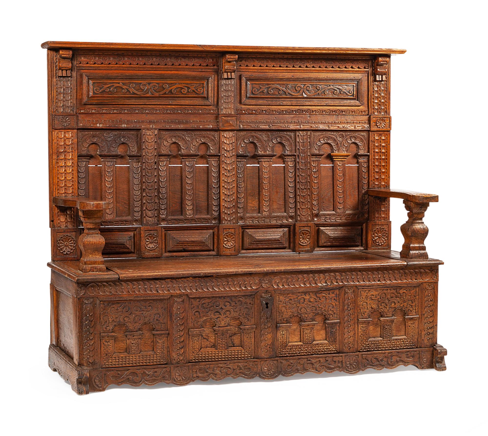 A Continental Carved Oak Settle