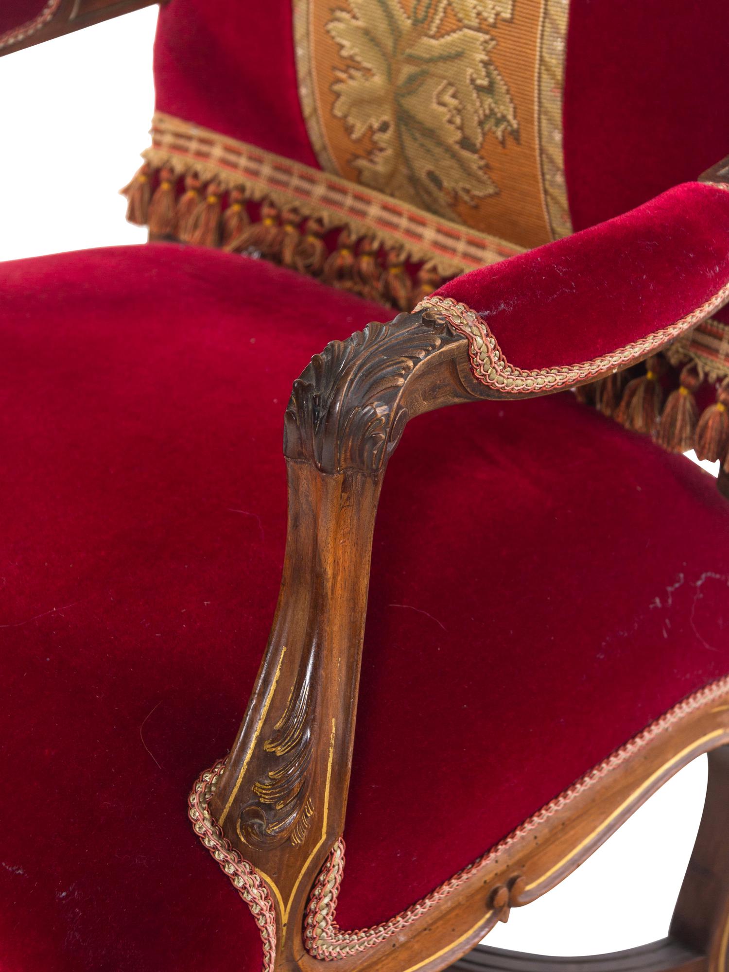 A Pair of Italian Louis XV Style Carved and Parcel Gilt Walnut Fauteuils