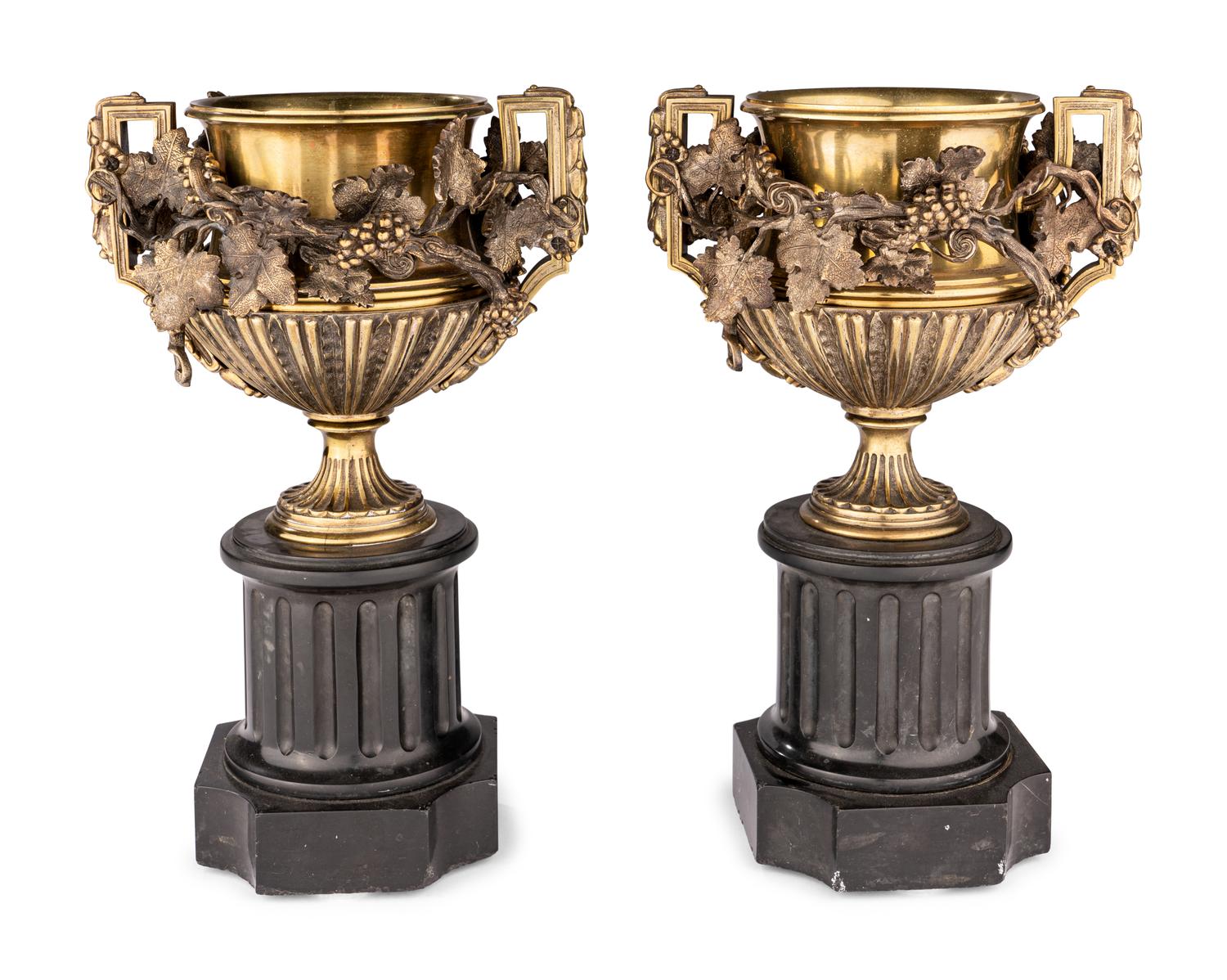 A Pair of Continental Gilt Bronze Urns on Slate Plinths