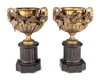 A Pair of Continental Gilt Bronze Urns on Slate Plinths