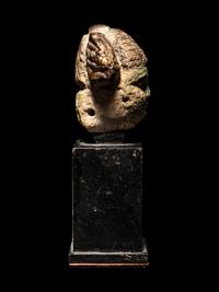 An Egyptian Faience Head of a Concubine