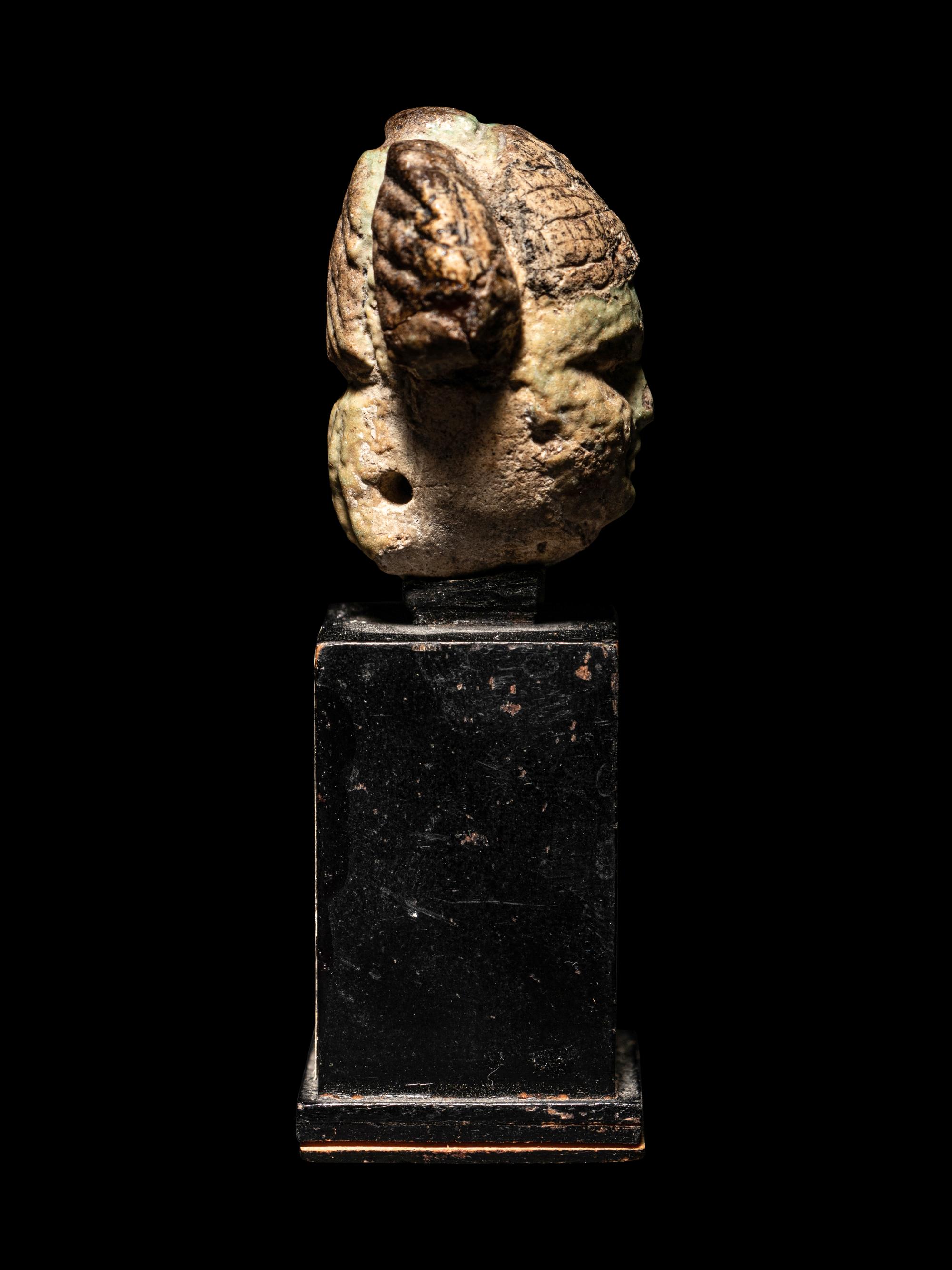 An Egyptian Faience Head of a Concubine