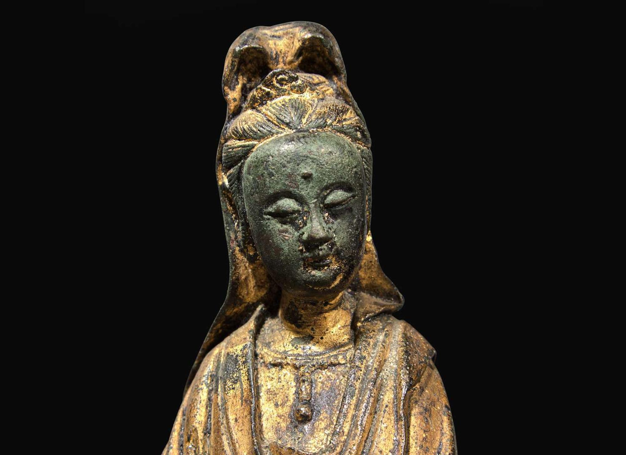 A Chinese gilt-lacquered bronze figure of Guanyin, 17th / 18th century 漆金銅觀音 十七或十八世紀