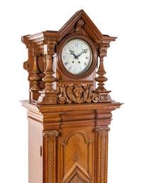 A German Walnut Musical Triple Disc Eroica Tall Case Clock, Height 85 1/2 inches.