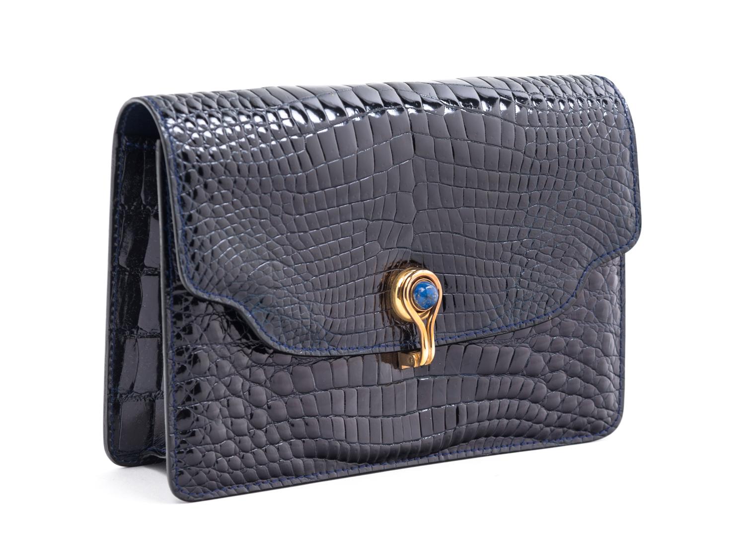 A Gucci Navy Skin Clutch, 8" x 5.5" x 2".