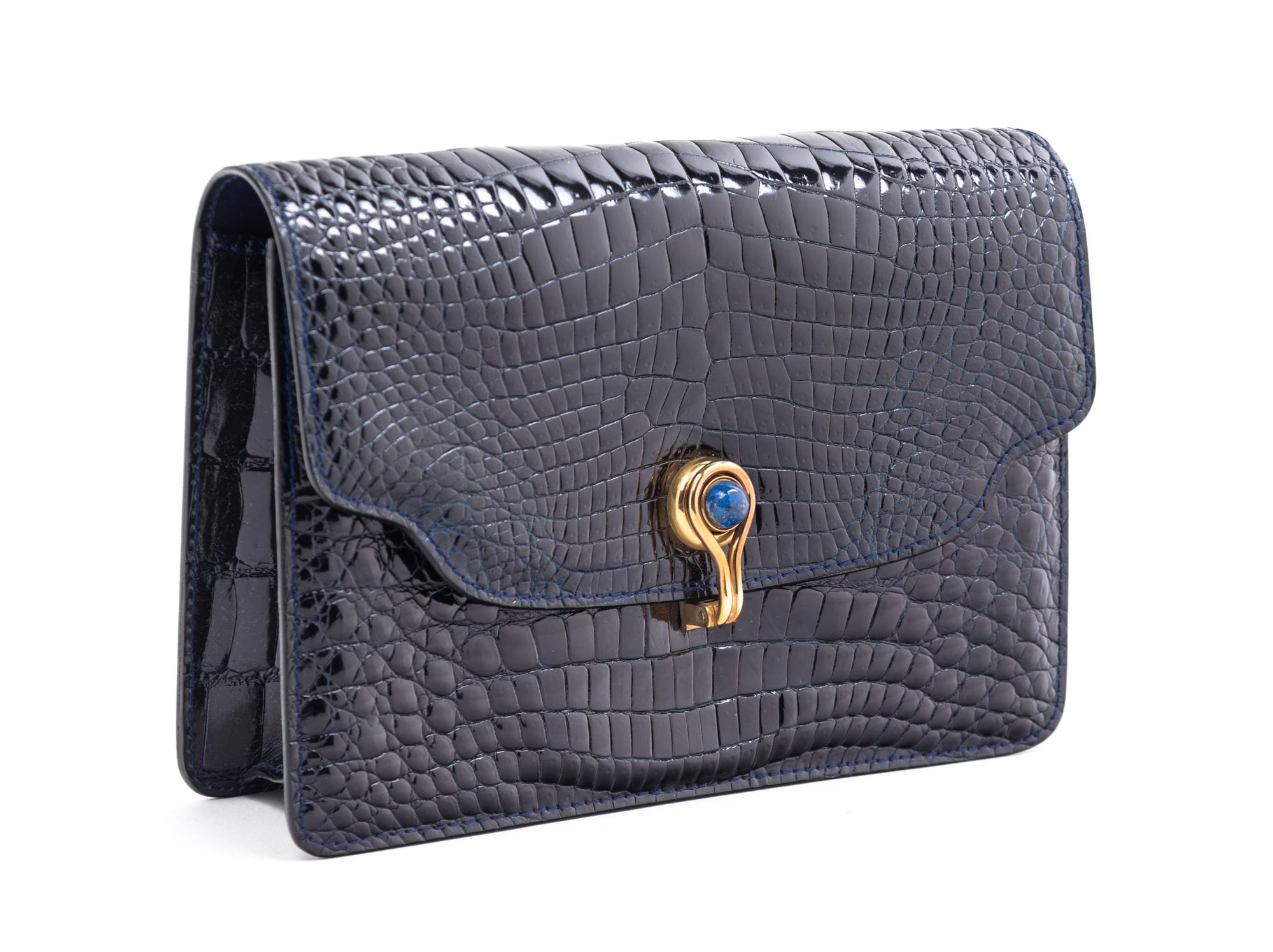 A Gucci Navy Skin Clutch, 8" x 5.5" x 2".