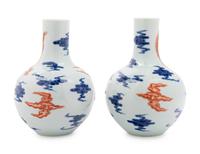 A Pair of Chinese Iron Red Decorated and Underglaze Blue Porcelain Bottle Vases