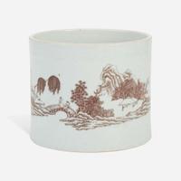 A Chinese underglaze red-decorated porcelain brush pot 釉里红画山水笔筒