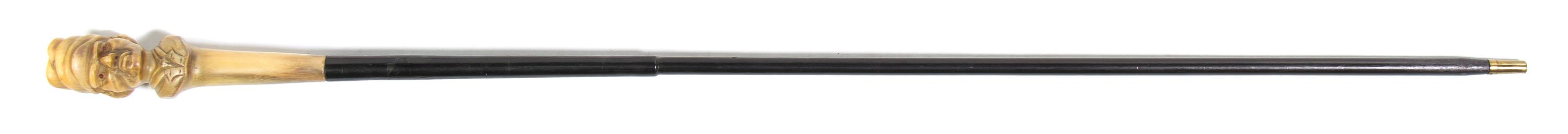 A Carved Horn Figural Walking Stick, Height overall 34 x height of handle 6 1/4 inches.