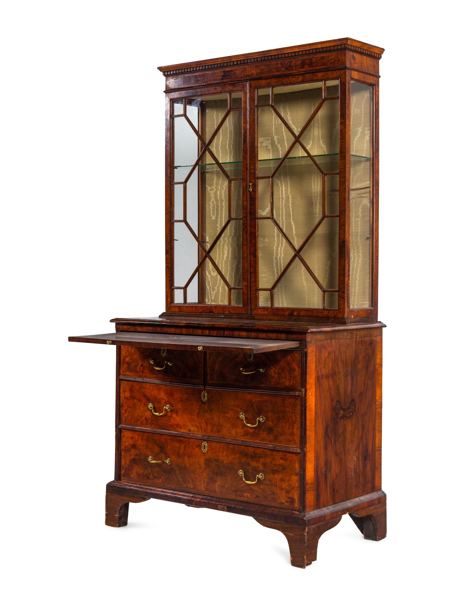 A George III Figured Walnut Bookcase-on-Chest