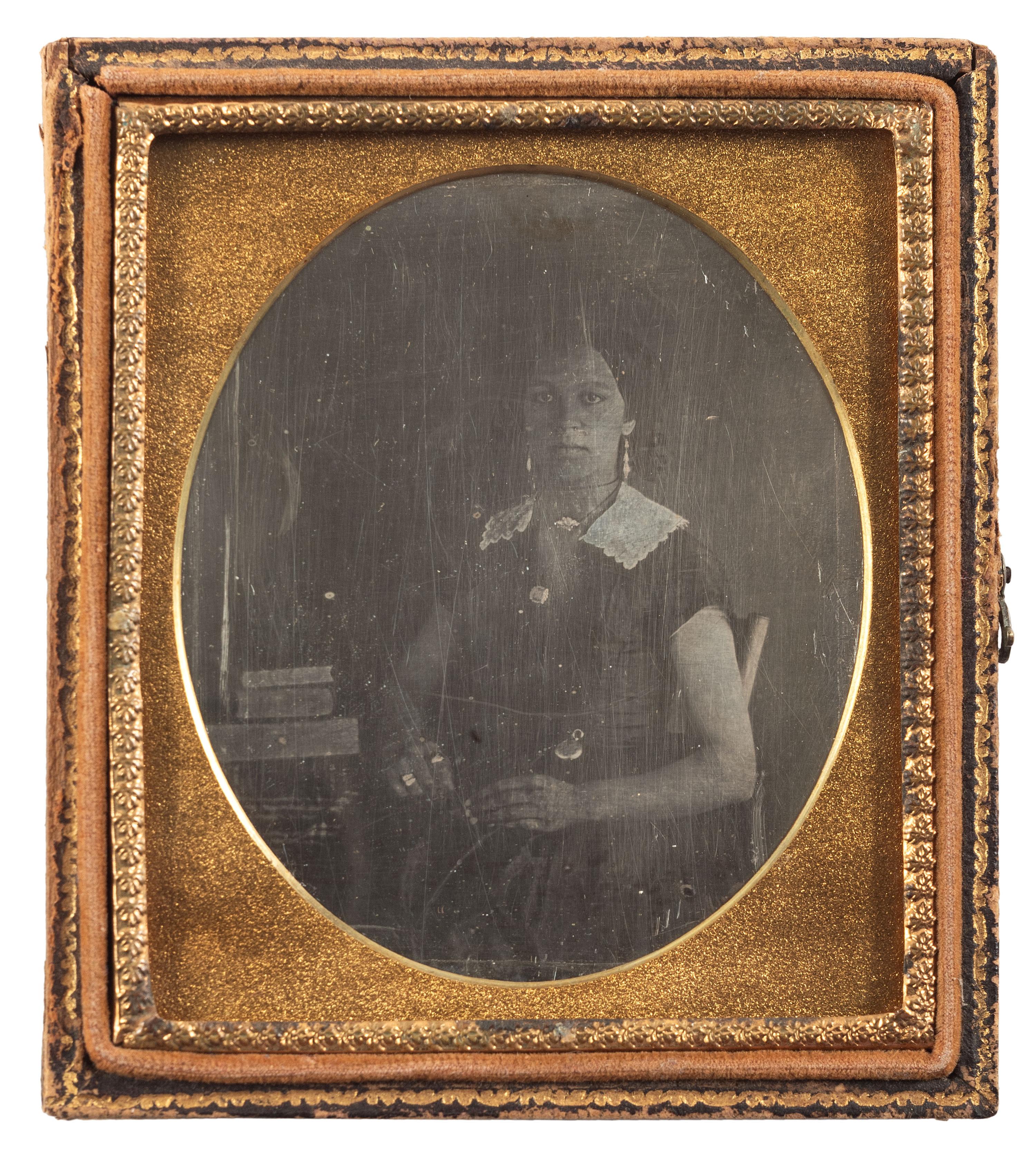 [EARLY PHOTOGRAPHY]. Sixth plate daguerreotype of a lovely African American woman. Ca 1850s.