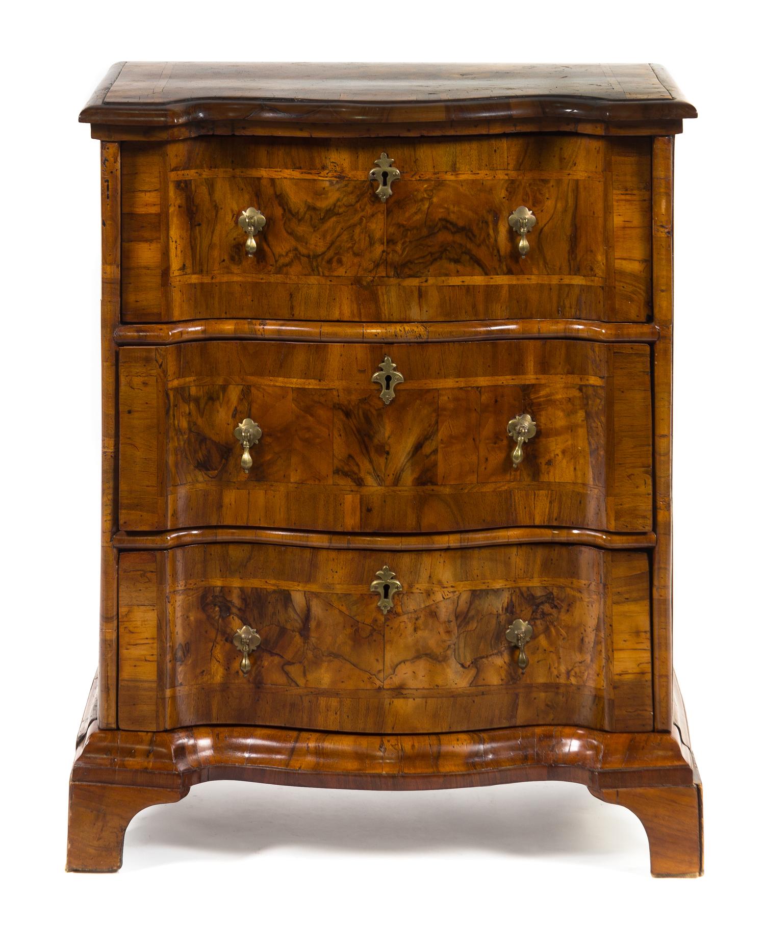 An Austrian Walnut Veneered Chest of Drawers Height 31 inches. — 19TH CENTURY