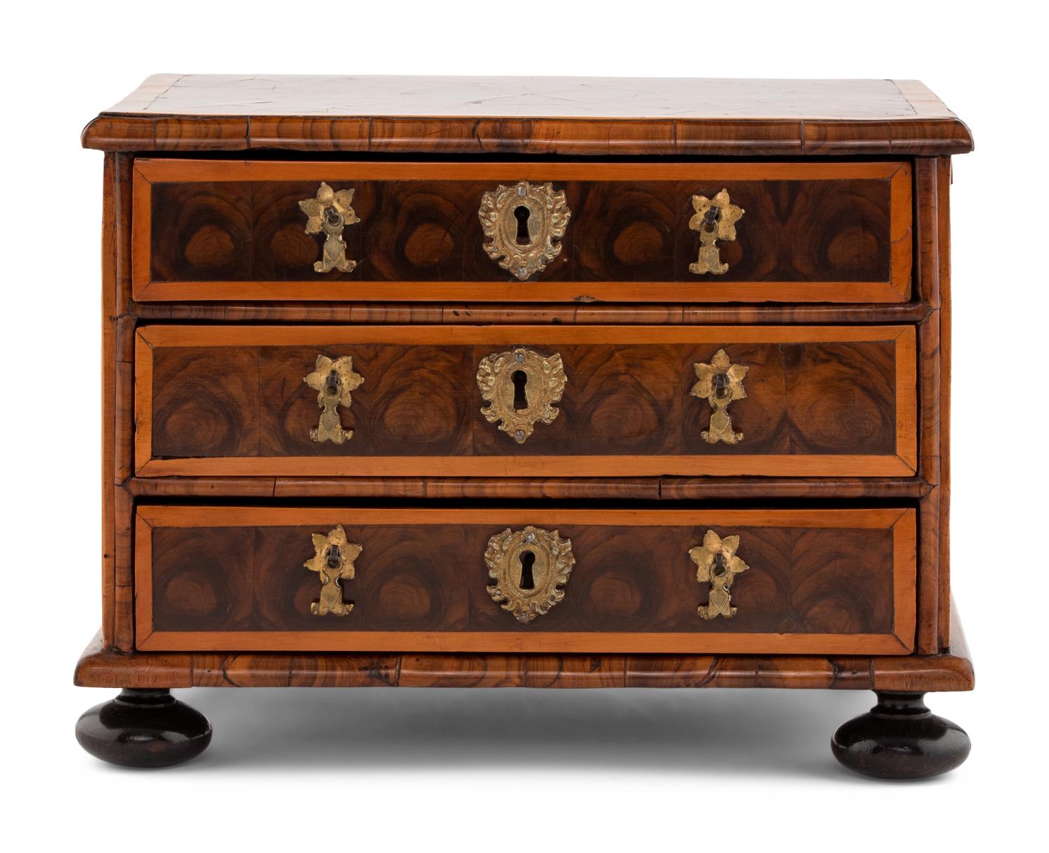 A George I Oysterwood Diminutive Chest of Drawers