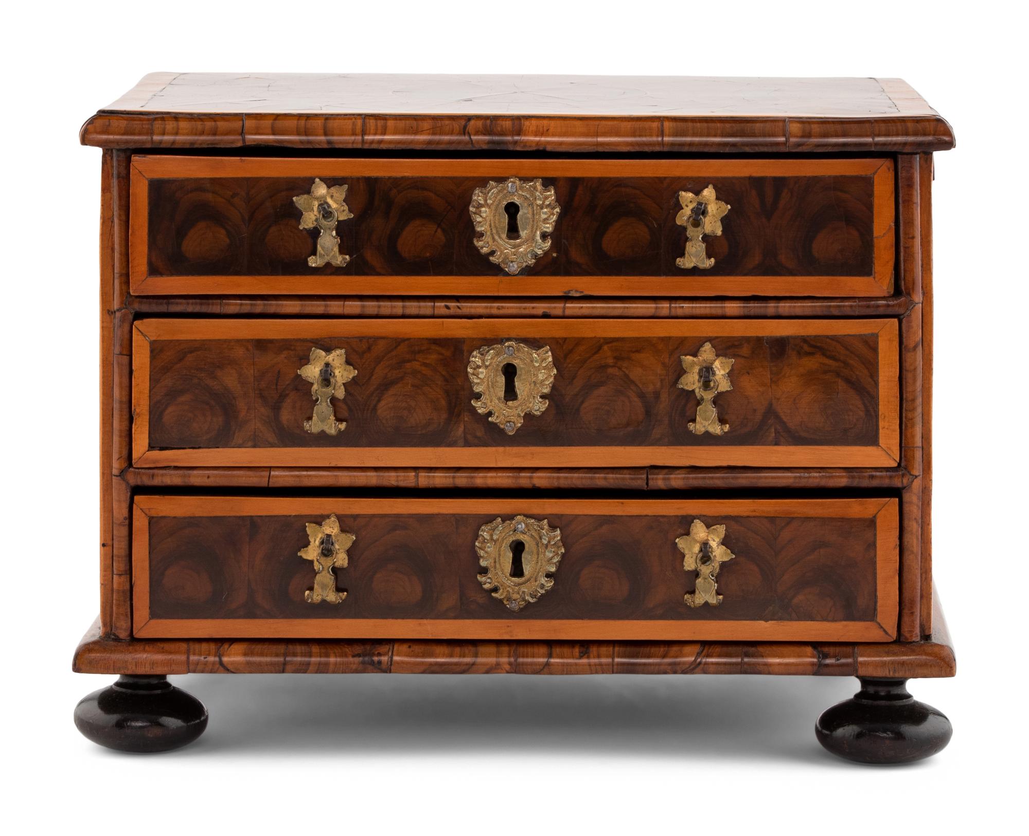 A George I Oysterwood Diminutive Chest of Drawers