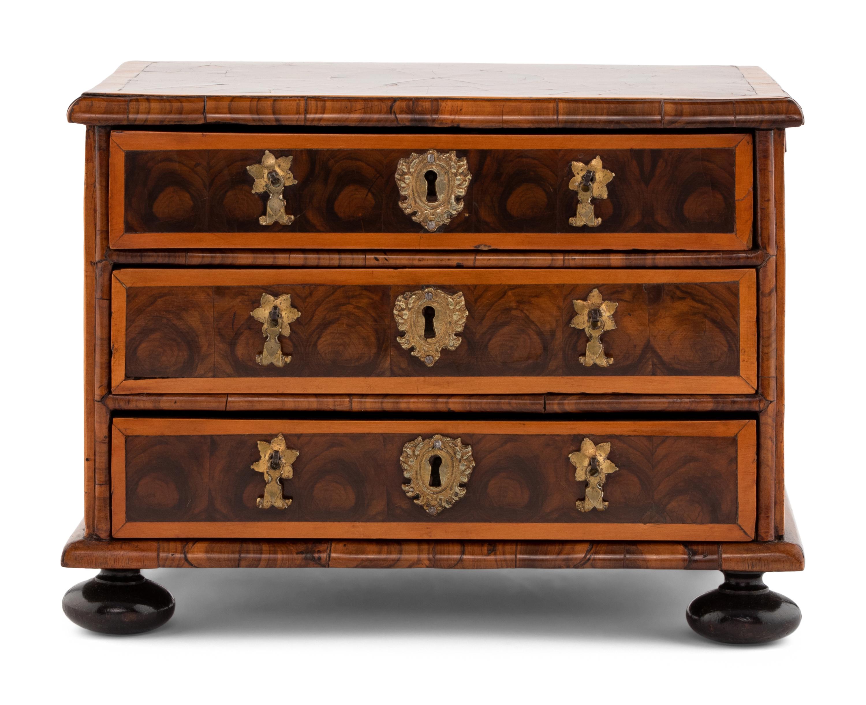 A George I Oysterwood Diminutive Chest of Drawers