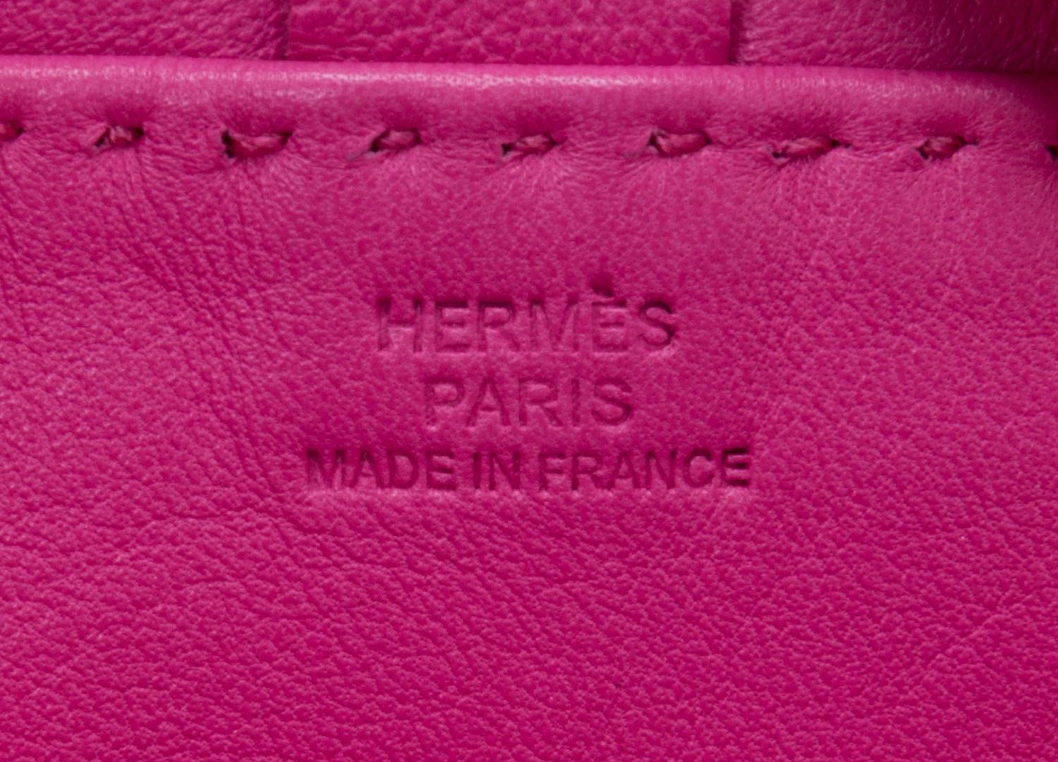 An Hermes Rose Tyrien Agneau Clou de Selle Pouch, 6" x 9" x 1".
