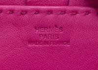 An Hermes Rose Tyrien Agneau Clou de Selle Pouch, 6" x 9" x 1".