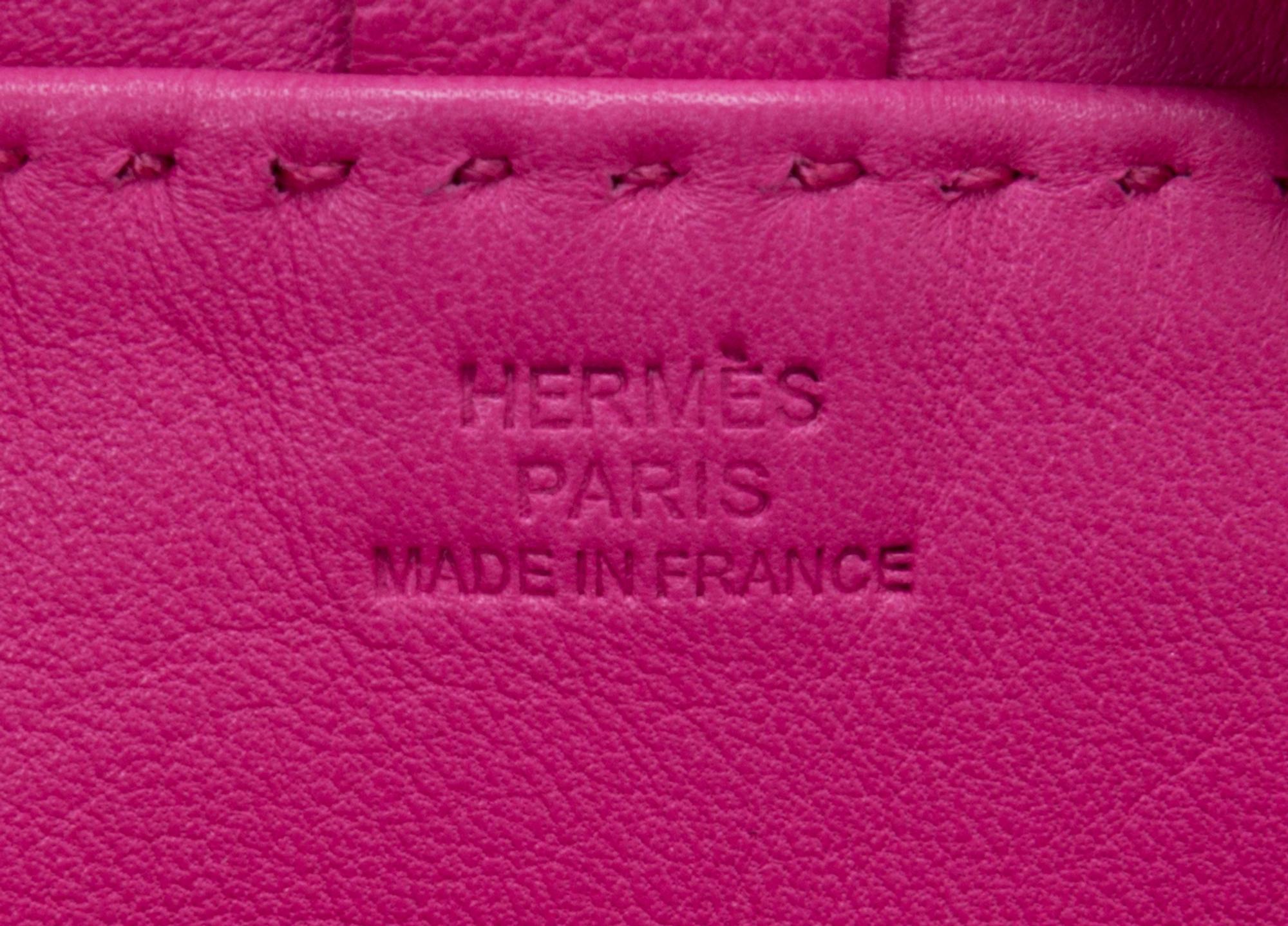 An Hermes Rose Tyrien Agneau Clou de Selle Pouch, 6" x 9" x 1".