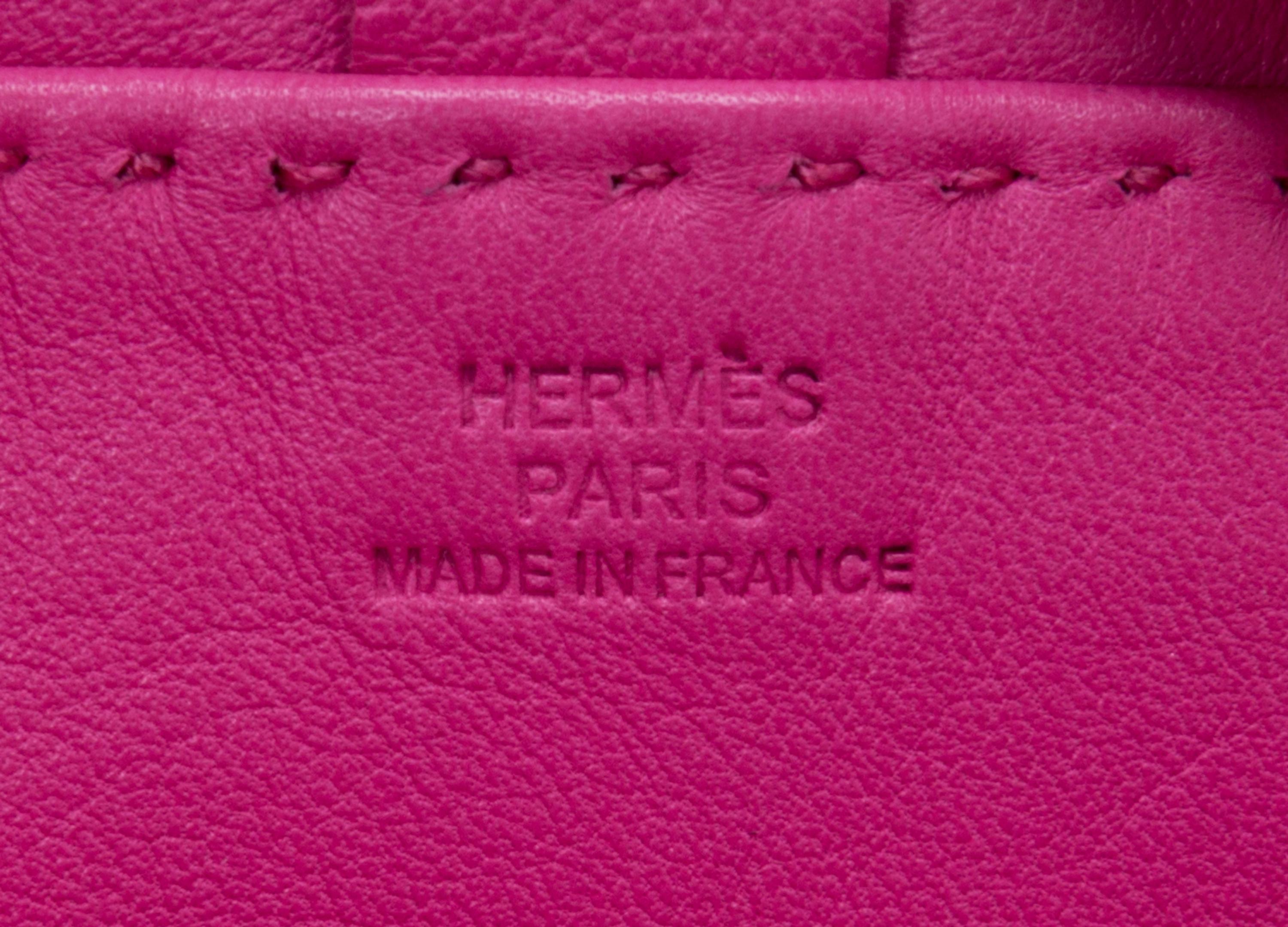An Hermes Rose Tyrien Agneau Clou de Selle Pouch, 6" x 9" x 1".