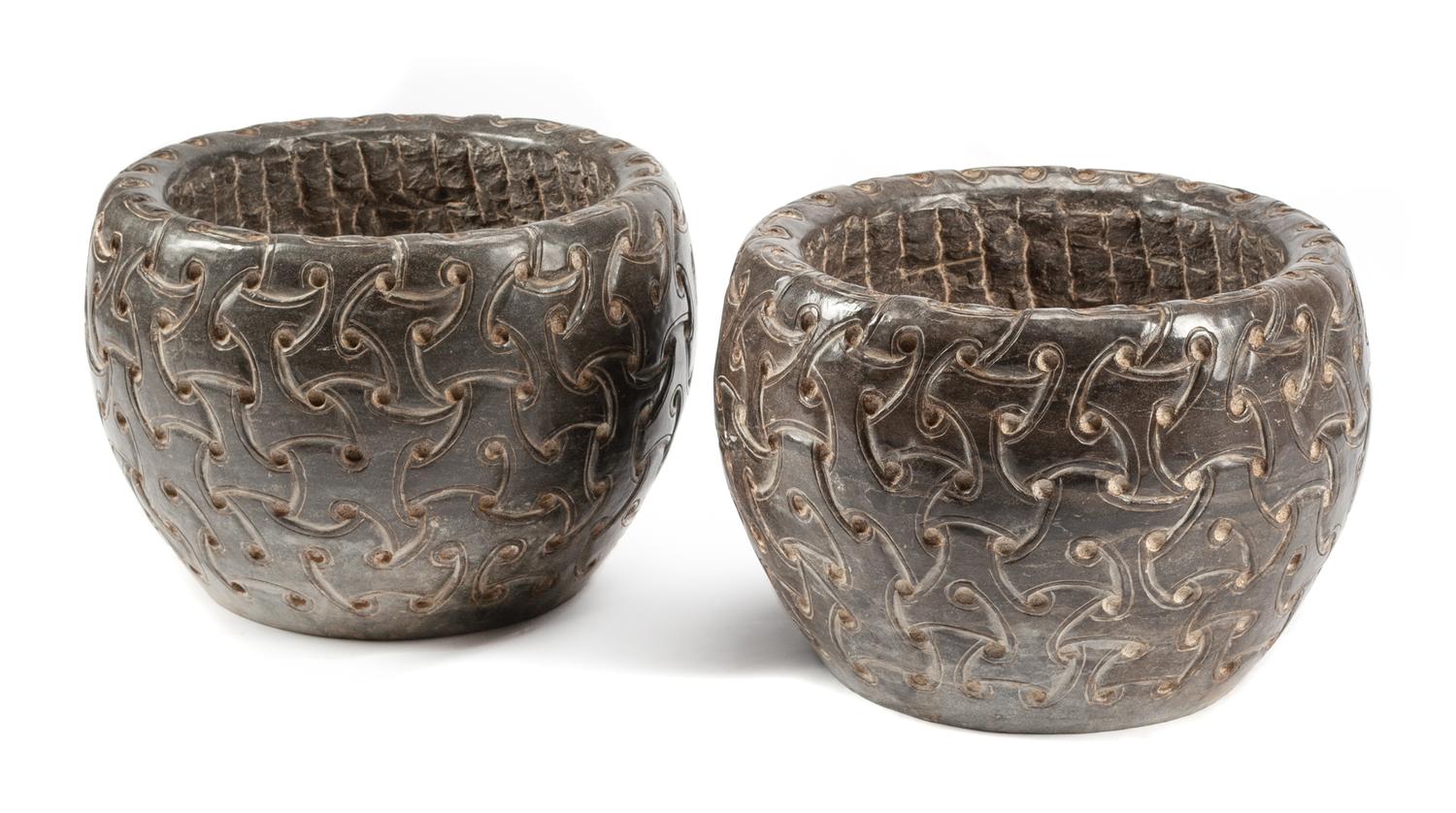 A Pair of Celtic Style Carved Stone Jardinieres Height 13 1/2 x diameter 19 inches.