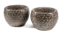 A Pair of Celtic Style Carved Stone Jardinieres Height 13 1/2 x diameter 19 inches.