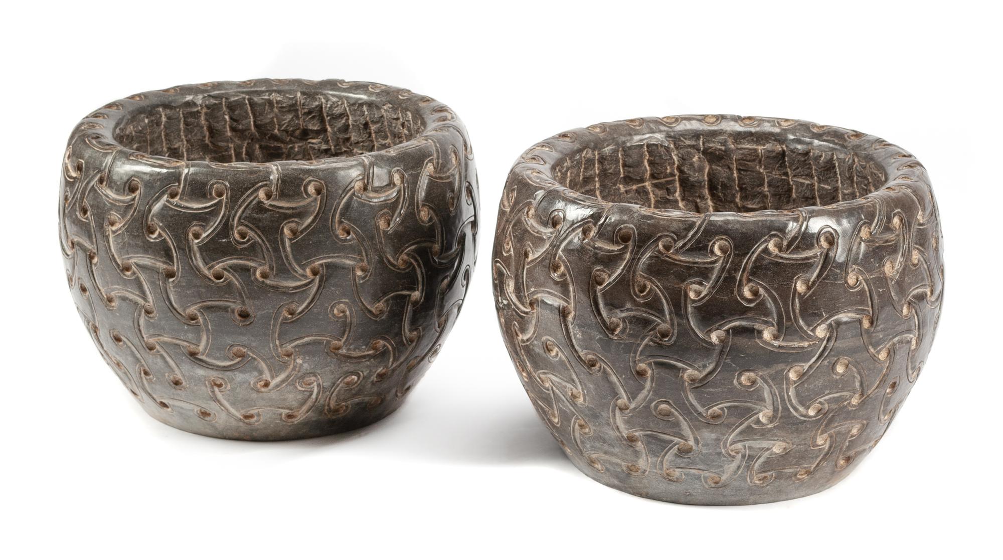A Pair of Celtic Style Carved Stone Jardinieres Height 13 1/2 x diameter 19 inches.