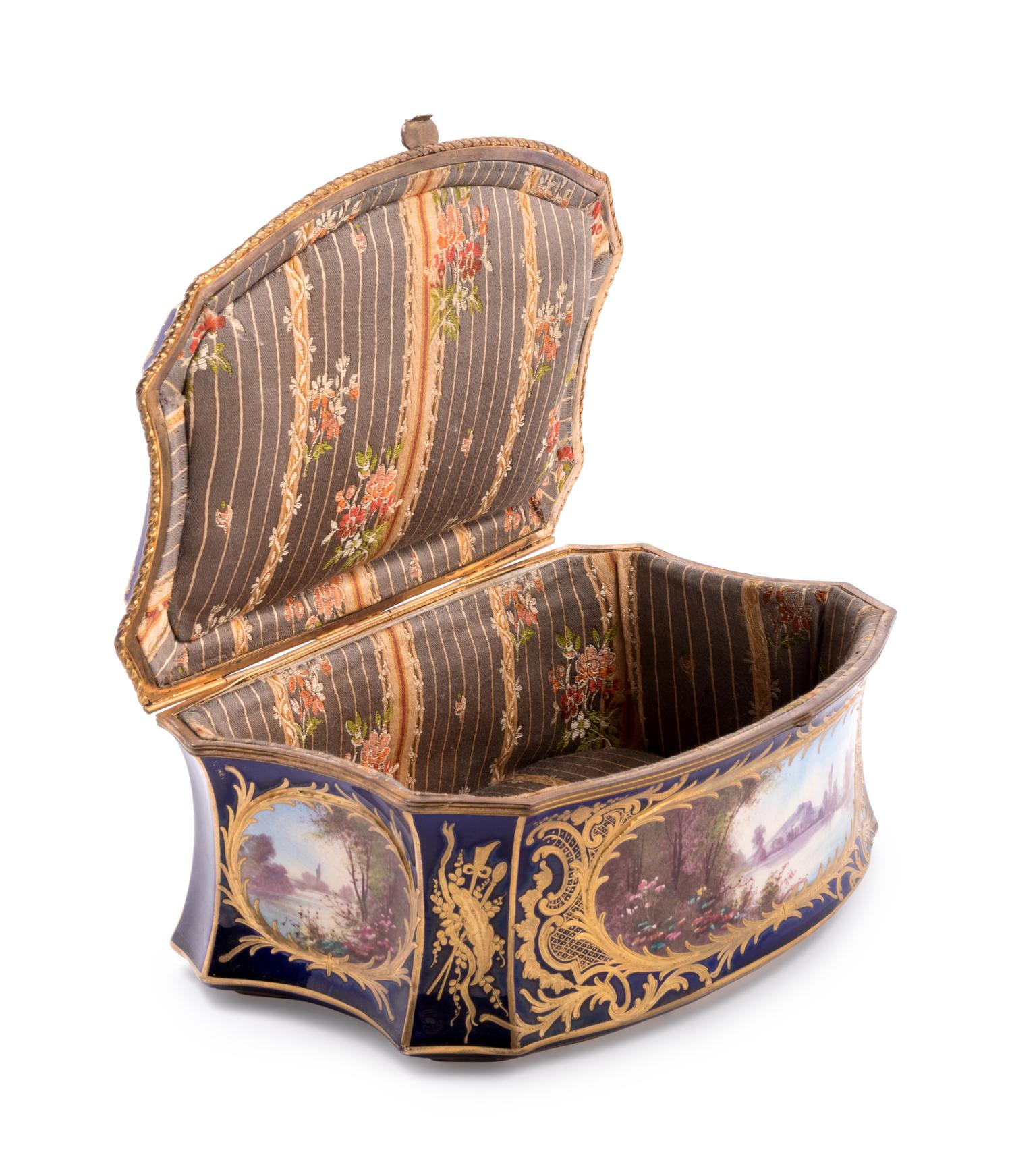 A Sèvres Style Painted and Parcel Gilt Porcelain Table Casket