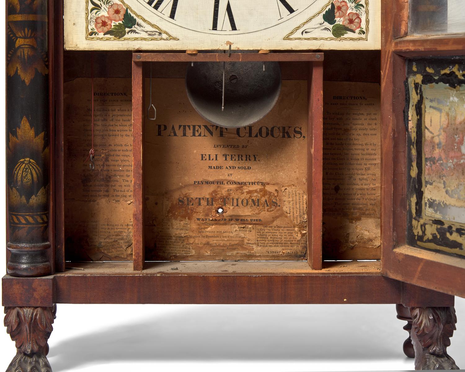 A Classical Carved Mahogany, Stencil-Decorated and Églomisé Shelf Clock