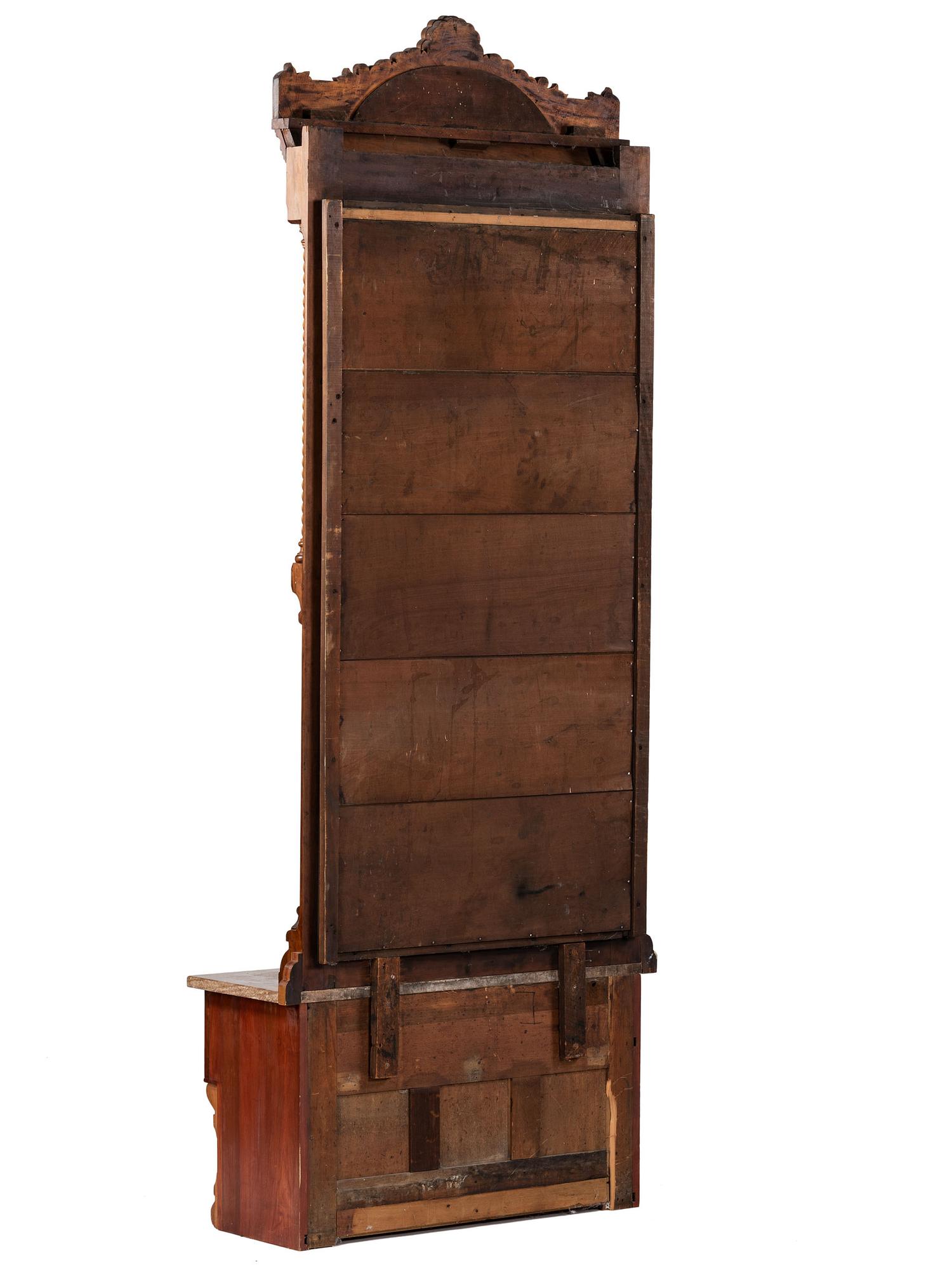 An Eastlake Style Hall Mirror with Marble Top Cabinet Base
