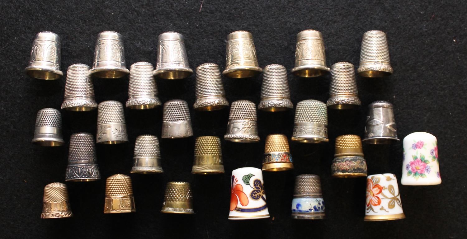 A Collection of Porcelain and Silver Thimbles Average height 1 inches. — VARIOUS AGES