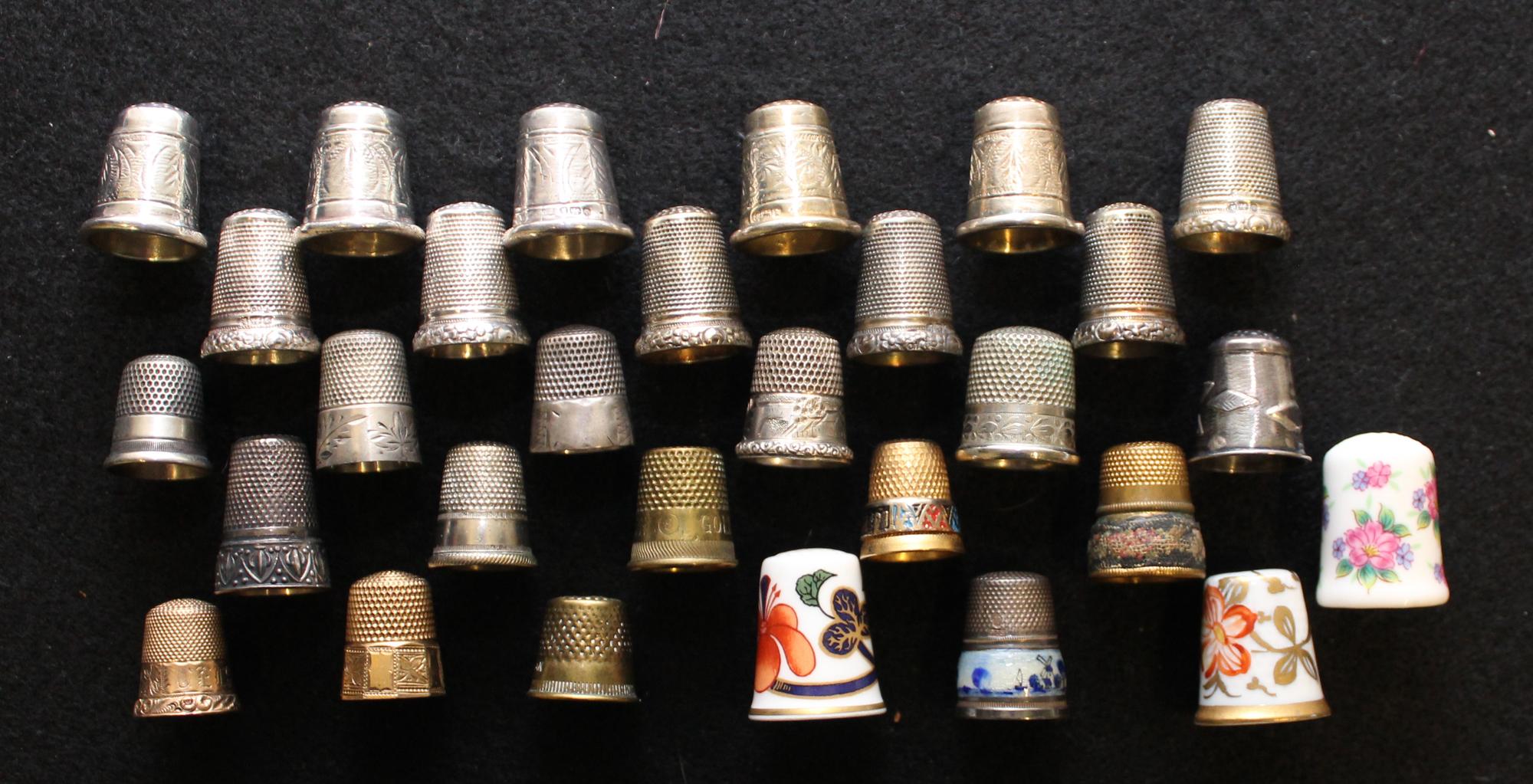 A Collection of Porcelain and Silver Thimbles Average height 1 inches. — VARIOUS AGES