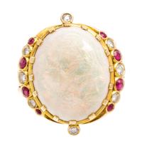 An 18 Karat Yellow Gold, Opal, Diamond and Ruby Ring, 6.90 dwts.