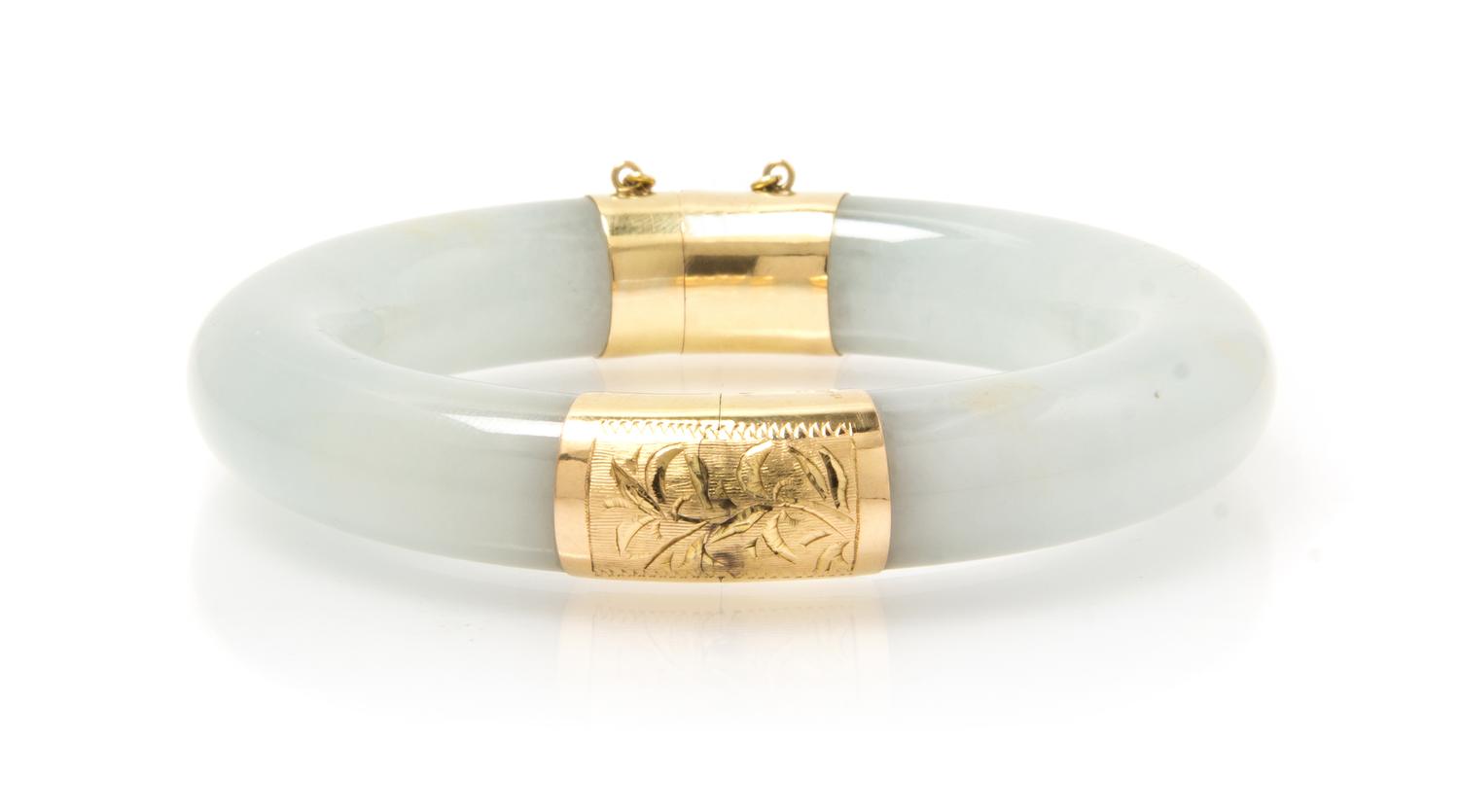 A 14 Karat Yellow Gold and Jadeite Bangle Bracelet, 64.40 dwts.