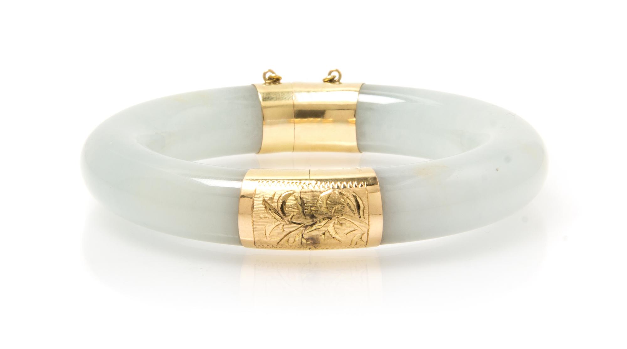A 14 Karat Yellow Gold and Jadeite Bangle Bracelet, 64.40 dwts.