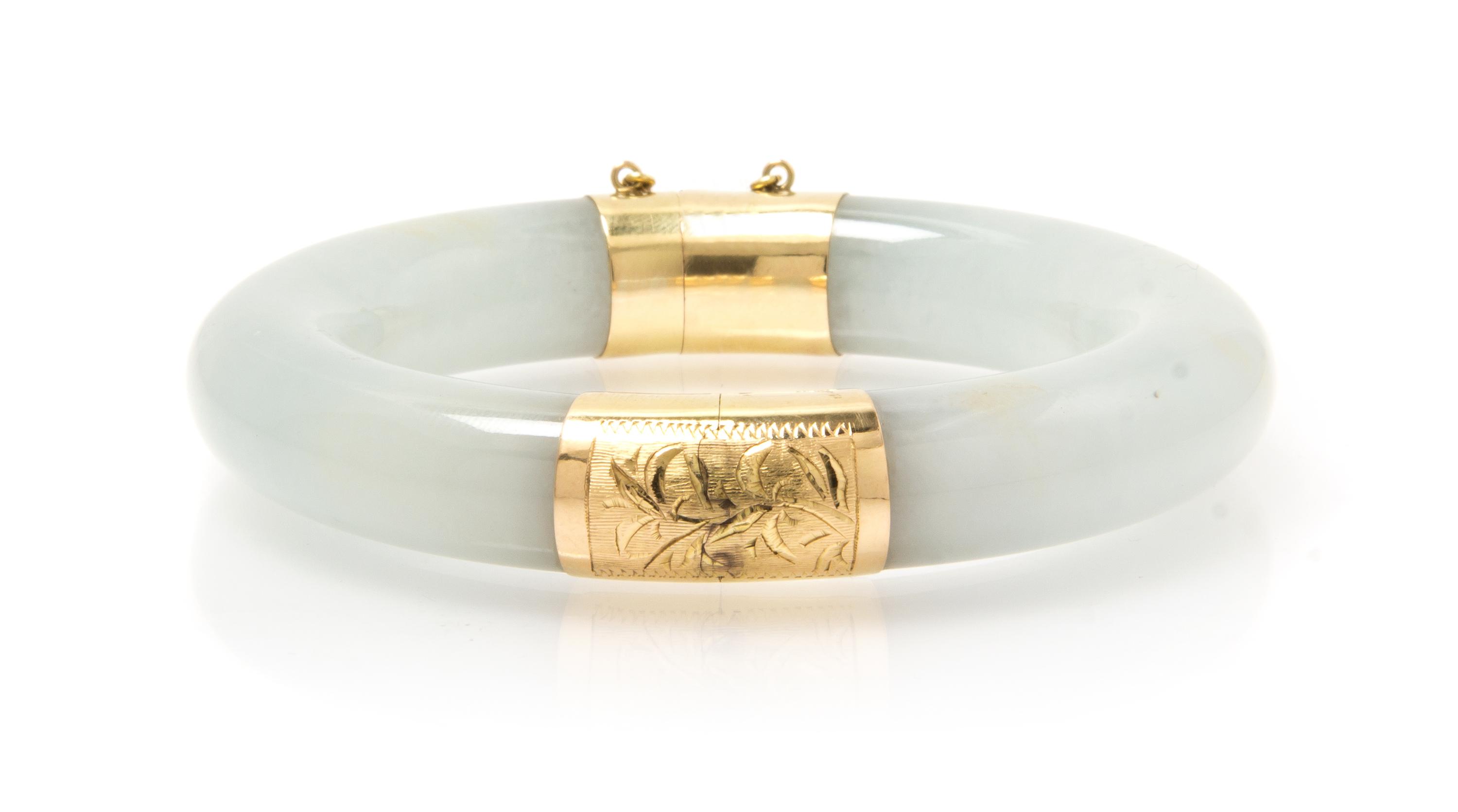 A 14 Karat Yellow Gold and Jadeite Bangle Bracelet, 64.40 dwts.