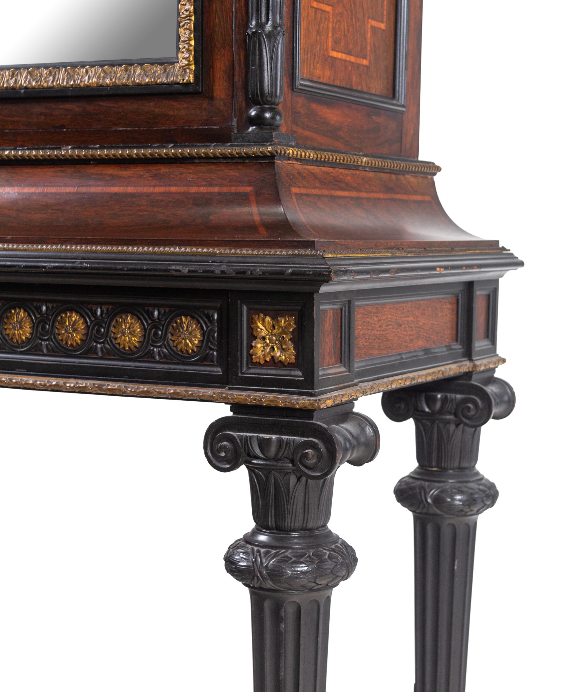 A Renaissance Revival Carved Walnut, Parcel Ebonized and Parcel Gilt Vitrine Cabinet on Stand