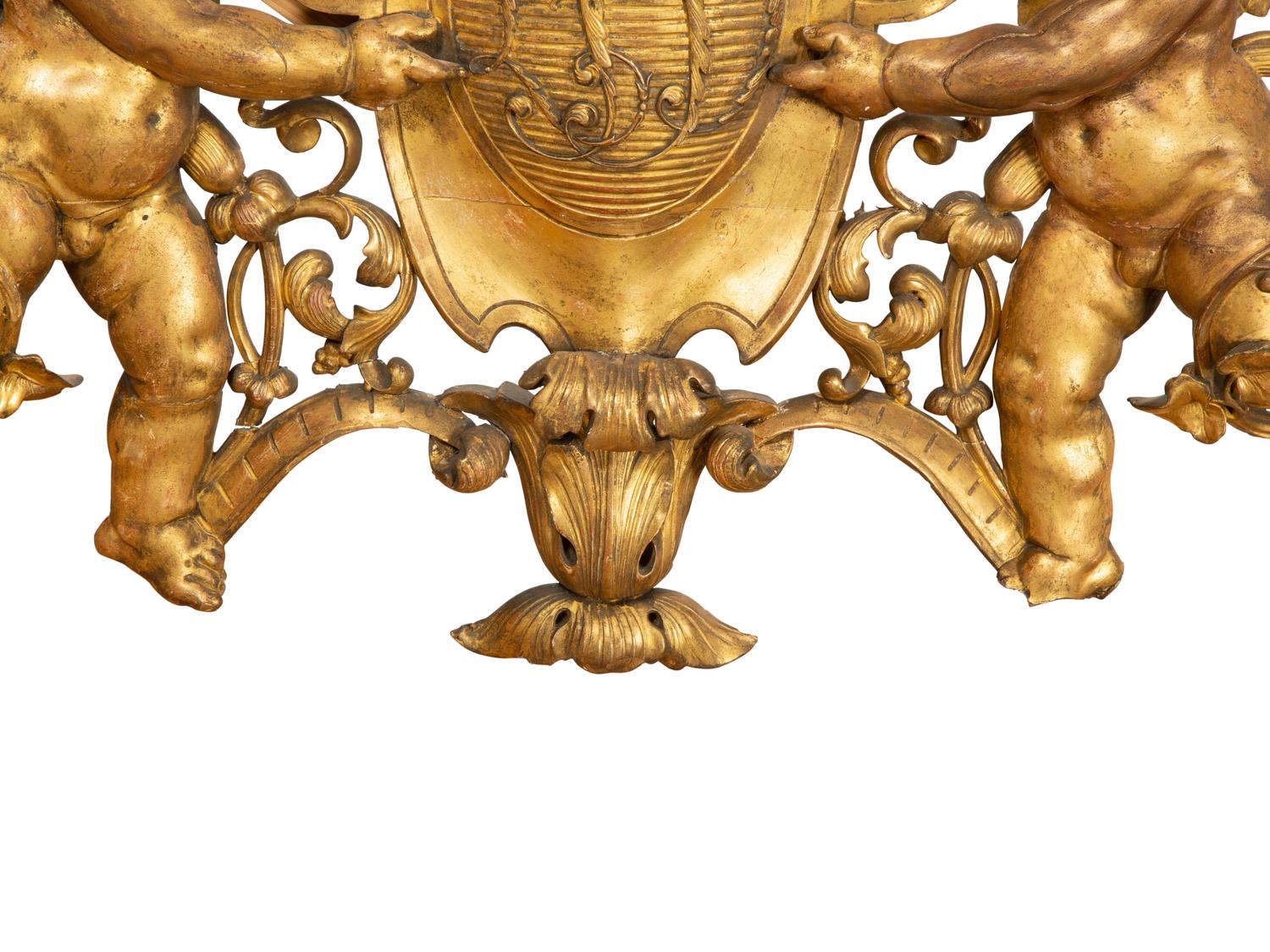 A Continental Carved Giltwood Cherub Wall Plaque