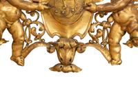 A Continental Carved Giltwood Cherub Wall Plaque