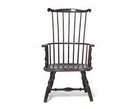A Turned and Black-Painted Comb-Back Windsor Armchair