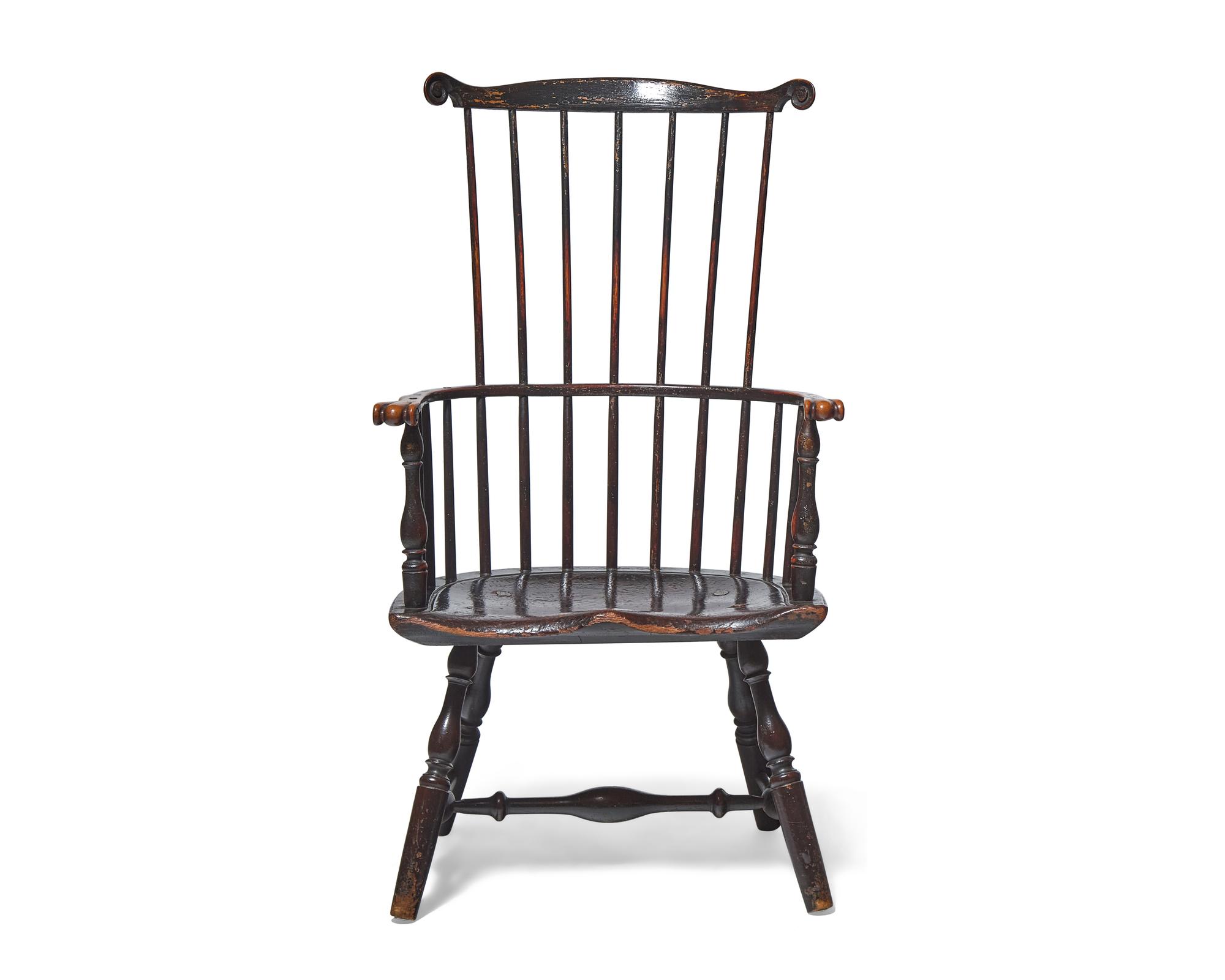 A Turned and Black-Painted Comb-Back Windsor Armchair