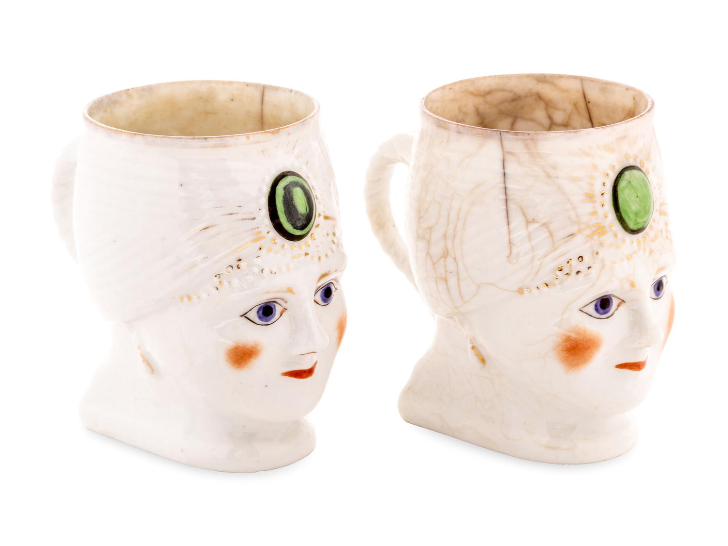 A Pair of Khrapunov-Novykh Porcelain Figural Mugs