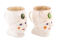 A Pair of Khrapunov-Novykh Porcelain Figural Mugs