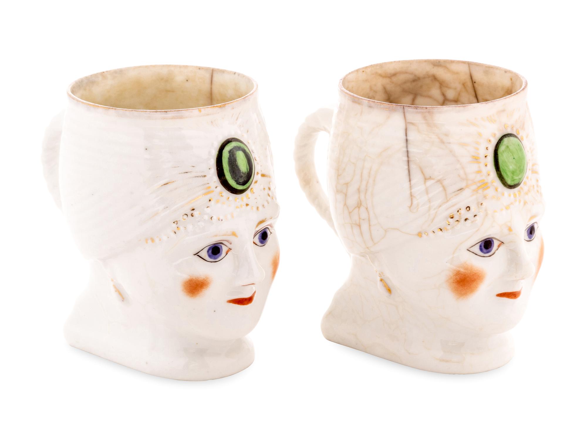 A Pair of Khrapunov-Novykh Porcelain Figural Mugs